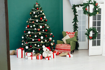 Fototapeta na wymiar Christmas tree with gifts decor new year interior holiday winter