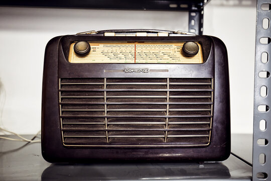 Vintage Lorenz transistor radio on the shelf of an antique store