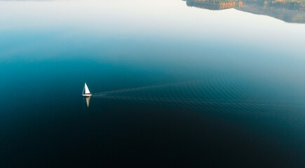 Yacht in blue lake in the evening with amazing background- beautiful  blue sky