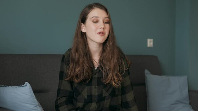Happy cheerful young woman blogger influencer having fun talking to camera recording vlog at home, smiling teen girl making video call internet chat laughing enjoy online conversation, webcam view