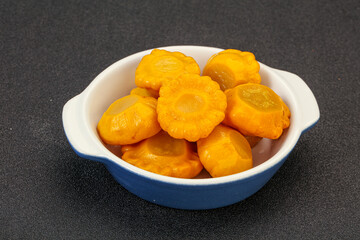 Marinated yellow patisson in the bowl
