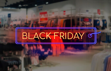 Black Friday sale neon sign. Blurred stop interior as a background. Seasonally sale, shopping and store concept.