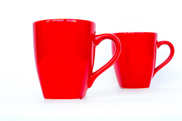 Red mug. Two red cups isolated on a white background.