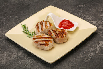 Grilled pork medallion with sauce