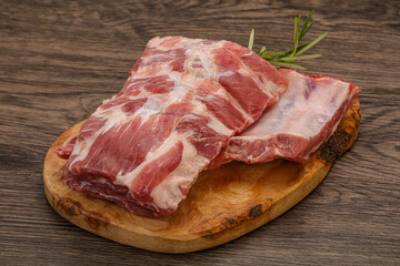 Raw pork ribs served rosemary