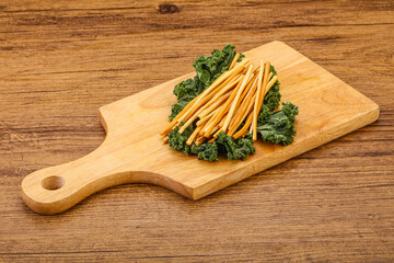 Chechel cheese sticks over board