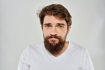 Bearded man gesturing with hand white cropped t-shirt studio lifestyle