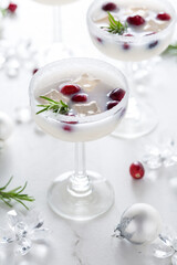 White Christmas margarita punch with cranberries and rosemary