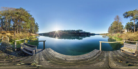 full spherical hdri panorama 360 degrees angle view on wooden pier near lake in forest in evening...