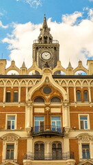 Naklejka premium Moscow house in pseudo-gothic style, decorated with clock tower and stucco