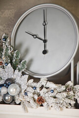 Christmas white clock with Christmas decorations close-up shows ten o'clock in evening. Concept of meeting Christmas and Happy New year. Copy space