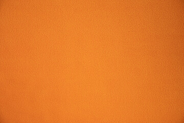 Fleece, polar or Blanket orange color fabric texture background.