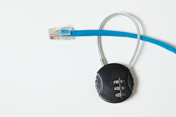 Locked cipher padlock and a blue network cable