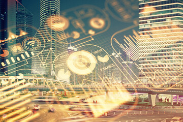 Double exposure of technology theme hologram and cityscape background. Concept of Hightech.