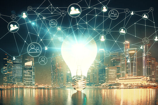 Multi exposure of bulb hologram drawing and cityscape background. Concept of idea.