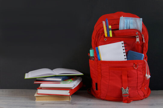 red schoolback on the table notes