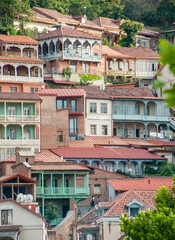 Fototapeta na wymiar Colourful homes on hillside in the old town of Tbilisi, Georgia