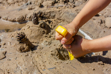 child playing in sand