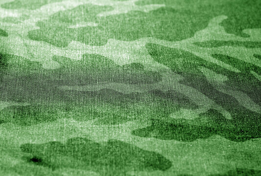 camouflage uniform background with blur effect.