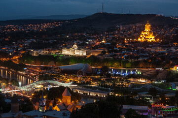 Tbilisi, Georgia at night with Holy Trinity catedral alight.