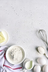 Bakiing background with ingredients for making cake or biscuit. Top view with copy space.