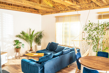 Mediterranean interior design of beautiful house, living room with big sofa and home green plants....