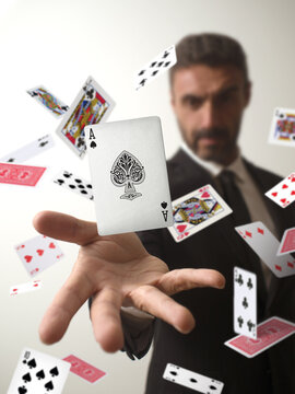 Magician making an ace of spades appear from a deck of cards