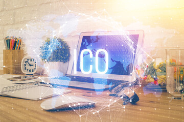 Multi exposure of blockchain and crypto economy theme hologram and table with computer background. Concept of bitcoin cryptocurrency.