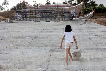 Children working at construction site for world day against child labor concept: