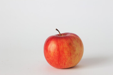 Single red ripe apple on a white background