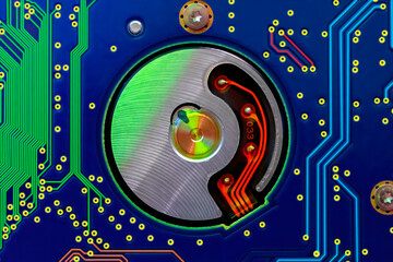 Macro top view of hard drive internal mechanism hardware ,with Phosphoric  green red and blue lines.