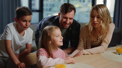 Cute family having video call at home. Parents kids enjoying online conversation