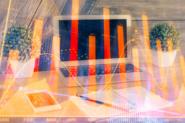 Double exposure of forex chart and work space with computer. Concept of international online...