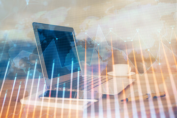Stock market graph and table with computer background. Multi exposure. Concept of financial analysis.