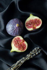 Ripe figs on a black background.