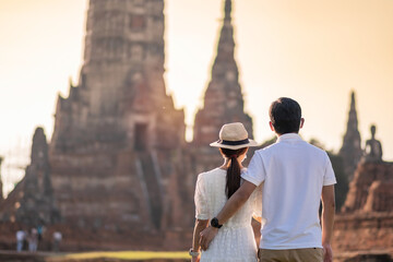 Couple Tourist wearing surgical face mask, protection COVID-19 pandemic during visiting in Wat...