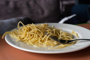 spaghetti on plate with fork 