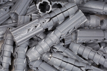 Pile of plastic wall plugs close-up