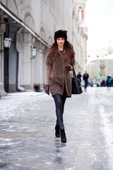 Obraz premium Young beautiful woman in stylish mink coat
