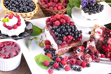 Cream cake with fresh raspberries and blueberries sweet dessert