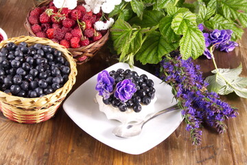 Cream cake with fresh raspberries and blueberries sweet dessert
