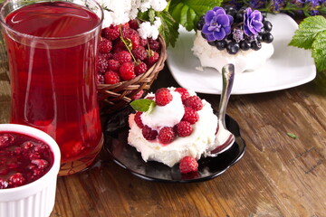 Cream cake with fresh raspberries and blueberries sweet dessert