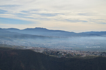 Fototapeta na wymiar Sierra Nevada and Villages seen from Dehesa del Generalife in Granada, Spain