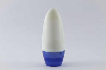 Deodorant with blue cap and white background