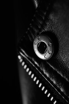 Black leather jacket and its metallic details
