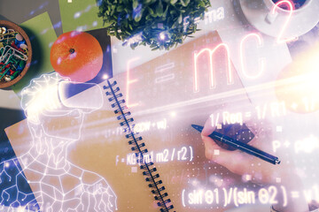 Science formula hologram over woman's hands taking notes background. Concept of study. Double...