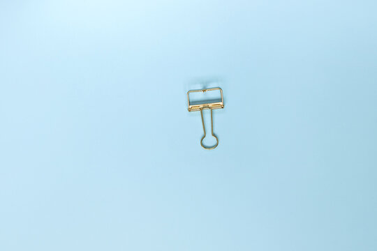 Gold Clip On Blue Background