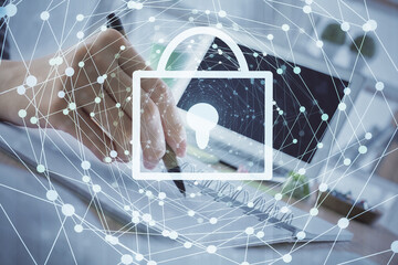 Double exposure of woman's hands writing with lock icon. Concept of security and protection of data