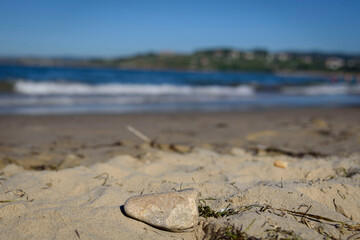 Sunny scenery of a sandy beach in the Oyambre natural park in San Vicente de la Barque