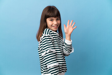 Little girl over isolated background saluting with hand with happy expression